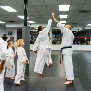 College-of-Martial-Arts-high-five